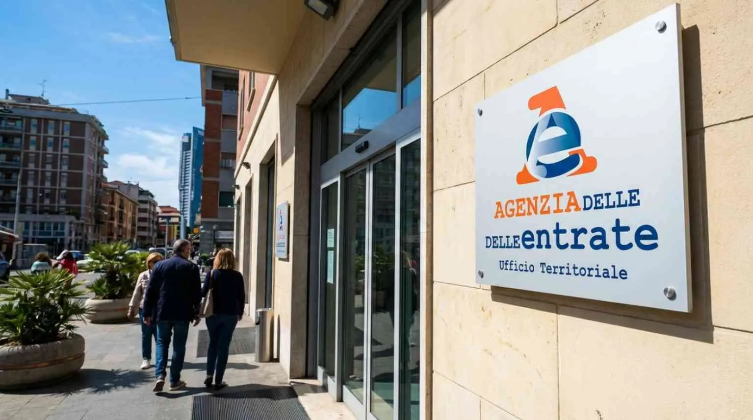 Ingresso ufficio Agenzia delle Entrate con logo istituzionale e bando concorso dirigente 2026